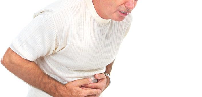 A man holding his stomach in pain.