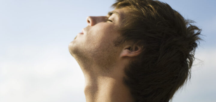 Man with his head back, showing his Adam's Apple